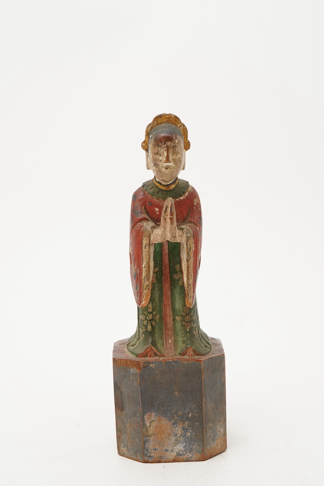 A Chinese polychrome wood figure of a female attendant, Qing dynasty
